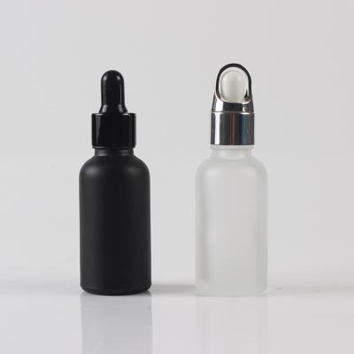 China Spray Glass Pharmaceutical Popular Bottle Sanding Black Bottle With Dropper For Essential Oil for sale