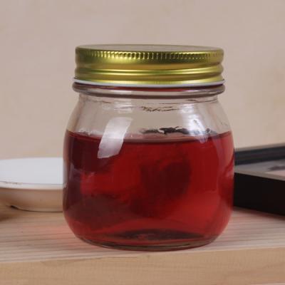 China Food 150ML 300ML 500ML 1000ML Honey Jar Glass Mason Jar With Gold Silver Screw Top Lid for sale