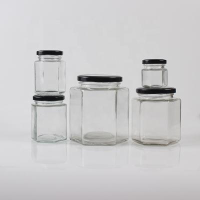 China CANDY 180ml 280ml 380ml 500ml 730ml Hexagon Jar Food Glass Bottle With Tin Lid Jam Glass Jar for sale