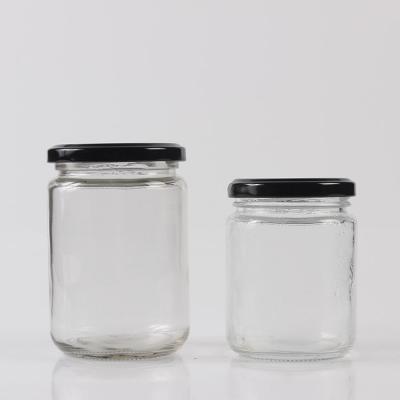 China 25ML 50ML 75ML 100ML 195ML Round Glass Bottle Honey Glass Jar With Tin Dish Lid for sale