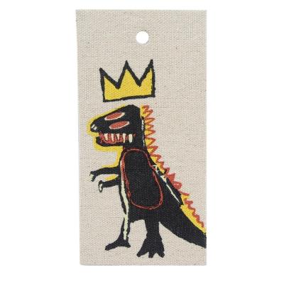 China Free Sample New Viable Low Price Design Custom Made Dinosaur Logo Canvas Fabric Label Printed For Apparel for sale