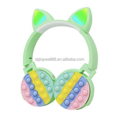 China Best selling cute design push bubble led cat unicorn popit earbuds wireless headphones for kids for sale