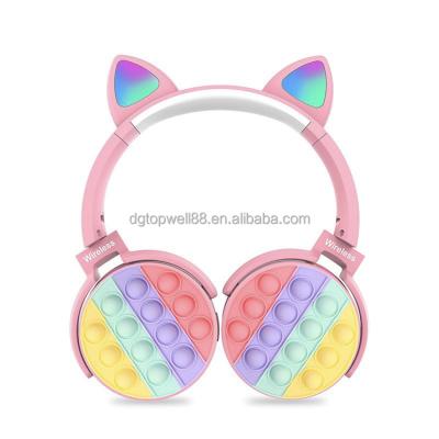 China Cute Design Silicone Popit Charging Led Cat Boy Popit Wireless Earphone for sale