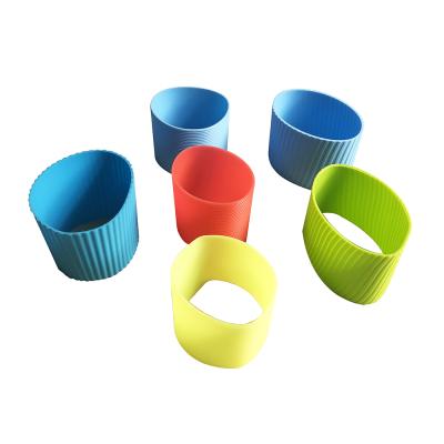 China Viable Heat Resistant Silicone Cup Sleeve Different Design Coffee Cup Silicone Holder for sale