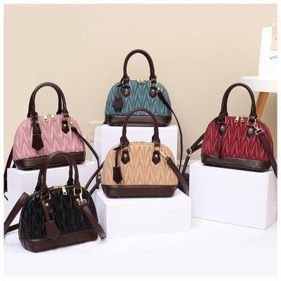 China New fashion plain textured women's bag pleated shoulder embroidered women's handbag all-match shell bag for sale