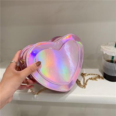 China Fashion New Fashion Women's Heart Shaped Handbag Laser Crossbody Leather Cross Shoulder Bag Cute For Girls for sale