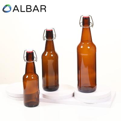 China Hot Sale Recyclable Eco-friendly 330ml 40oz 750ml Amber Empty Beer Brown Clear Round Bottles With Logo Printing Flip Top Crown Caps for sale