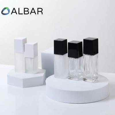 China Eco-friendly 30ml 50ml Recyclable Foundation Serum Essential Oil Glass Liquid Bottles For Skin Care With Black Or White Caps for sale