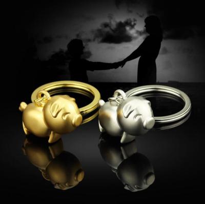 China Kissing Pig Keychain Twelve Chinese Zodiac PIG Animals Shape Mini Metal Anime Key Chain Purse Milk Pig Key Chain for sale