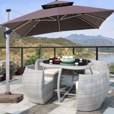 China Morden Modern Style Outdoor Summer Patio Garden Furniture Set Tempered Glass Cane Outdoor Coffee Table and 4 Chairs for sale