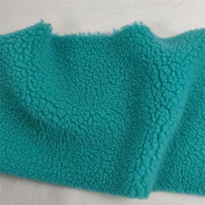 China Hot Selling Faux Fur Fabric Small Grain South Australia Memory Plush Fabric Polyester Soft Lamb Toy Fabric for sale