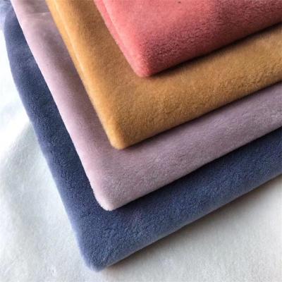 China New wholesale popular high quality soft long pile polyester cheap fabric plush fleece dyeing fabric for sale