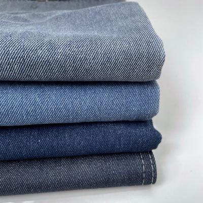 China Factory hot sale breathable 11.2 oz dark blue left twill tc jeans fabrics for shirts and pants for sale