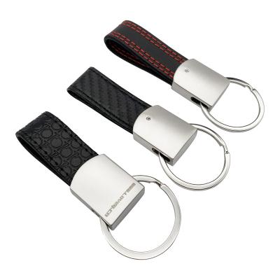 China Gift Embossed Pattern Carbon Fiber PU Leather Belt Key Ring Carved Logo Key Chain for sale