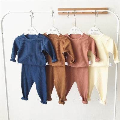 China Anti-wrinkle 2022 two-piece boys and girls ribbed spring and autumn home clothes pajamas cotton suits basing organic shirts baby clothes for sale