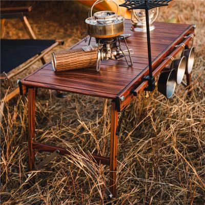 China OnwaySports Modern Egg Roll Up Portable Outdoor Table Mesa Plegable Lightweight Aluminum Woodgrain Camping Table With Cup Holder for sale