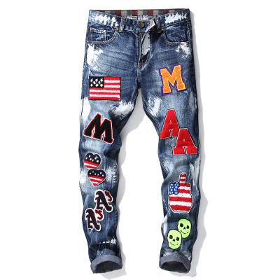 China Windproof Letters Embroidered Flag Emblem Mens Slim Fit Jeans Stretch Straight Mens Pants for sale