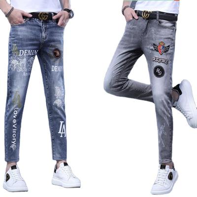 China Custom Embroidered Monogram Hand Painted Denim Small Leg Men's Windproof Soft Straight Jeans for sale