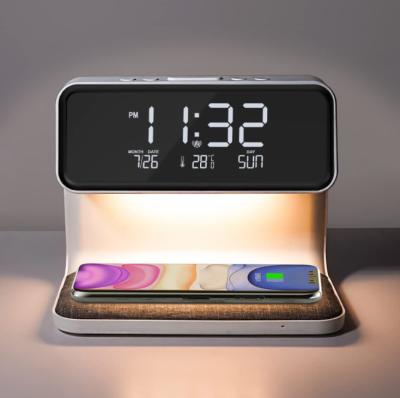 China Modern Design Night Light Modern Design Bedside Table Lamp A26 with Wireless Charger and Alarm Clock for Bedroom for sale