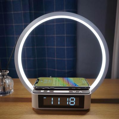 China 3-grade Glow Touch Control Bedside Wake Up Lamp Wireless Charger Alrarm Clock For Bedside Table for sale