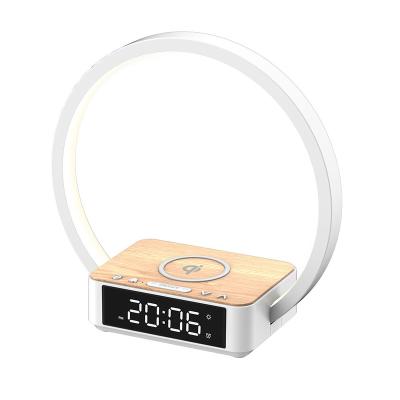 China Amazon Hotsales 5w wireless charger 3-grade shine touch control wake up lamp with alarm clock bedroom lights for sale