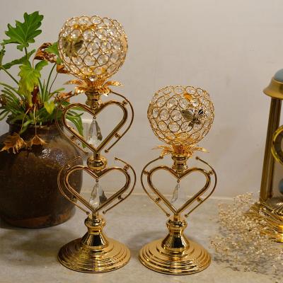 China Luxury Home Decor Metal Gold Crystal Ball Heart Pillar Candlestick Holder for Wedding Home Decor for sale