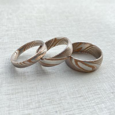 China Punk Customize 8mm 6mm 4mm Rose Gold Plated Damascus Band Ring For Men Durable Wedding Band Jewelry for sale