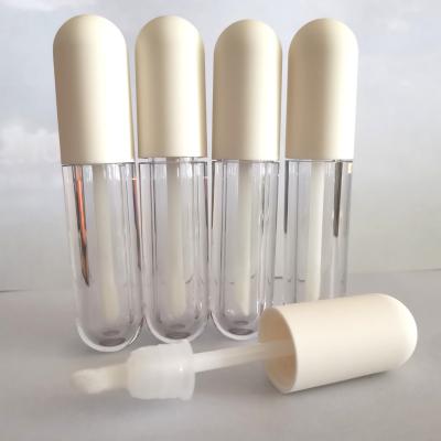 China 2022 Cosmetics New Capsule Shape 4.5ml Beige Mini Empty Lip Gloss Tube With Wand Brush for sale