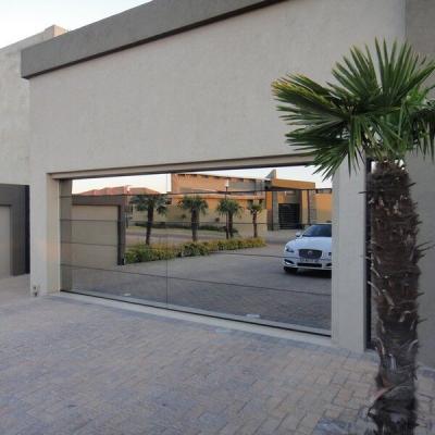 China Modern Frameless Automatic Mirror Glass Panels Garage Door Prices for sale