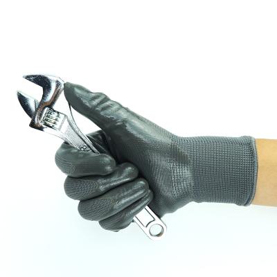 China Widely applied top quality polyester nitrile coated work gloves with elastic yarn knitted cuff for sale