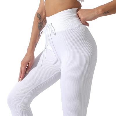 China Breathable Seamless Yoga Sportswear For Yoga Sport And Gym Training Newcomers Fashion Women Solid Waist Drawstring Leggings for sale