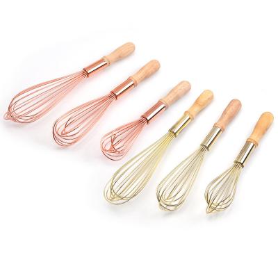 China Large Sustainable Food Grade Silicone Beater Set Professional Baking Tool Beater With Wooden Handle for sale