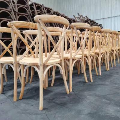 China Factory Direct Stable Comfortable Stackable Cross Back Events Style French Style Chair Wood Dining Wedding Chairs for sale