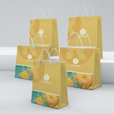 China 2022 New Recycled Materials Cardboard White Paper Bag With Logo Print Paper Packaging Bag With Handle for sale