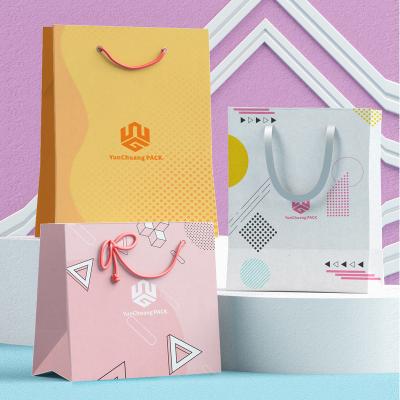 China Recycled materials factory direct clothing underwear perfume open paper bag luxury paper bag with handle for sale