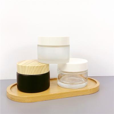 China Cosmetic New Product Clear Amber Glass Cream Jar With Gold Black Sliver Aluminum Cap for sale