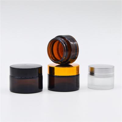 China Personal Care Cheap Price Frosted Black Eye Cream Glass Cosmetic Bottle With Blue Cap Amber for sale