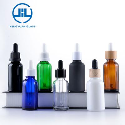 China Personal Care E Liquid Packing Blue Green Amber Customize Round Glass Dropper Essential Oil Bottle for sale