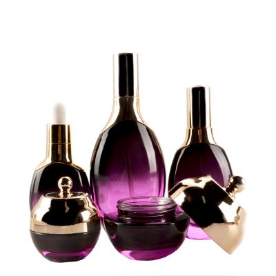 China Personal Care Luxury Gold 30ml50ml Purple Sliver Glass Bottle Cosmetic Lotion Bottle For Pump for sale