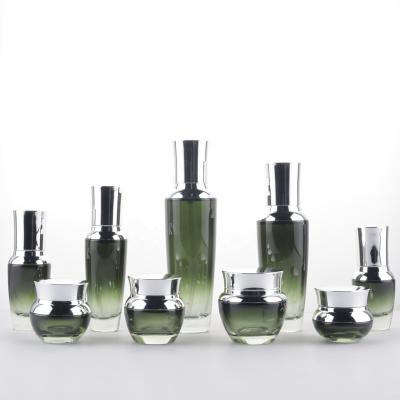 China Wholesale New Gift Manufacturer Dark Green Cosmetics Glass Bottles For Packaging for sale