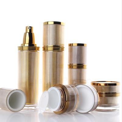 China Luxury cosmetic packaging gold bottle with pump spray for lotion supply packaging design for sale