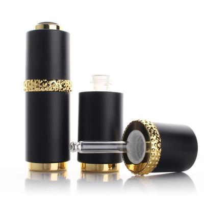 China Hot Sale Cosmetic Black Luxury Packaging Press On Dropper Bottle With Essence Oil Bottle for sale