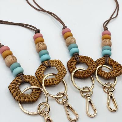 China Boho Festivals Style Woven Geometric Wooden Nylon Lanyard Chips Wood Beads Silicone Beads Teacher's Day Gift Key Chain for sale