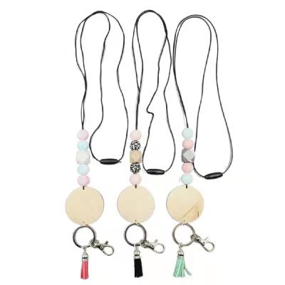 China Convenient Neutral Tones Custom Silicone Wood Beads Tassel Detached Collar Leather Lanyard Leopard Key Chain Handmade Key Chain for sale