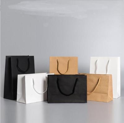 China Recycled Materials Luxury Brand Logo Gift Custom Paper Bag For Apparel Matte Boutique Clothing Garment Packaging Bags With Ribbon Handles for sale