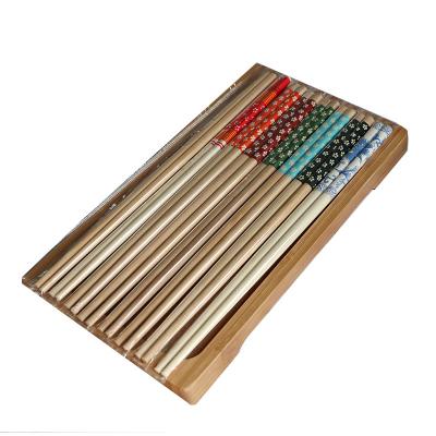 China Disposable 24cm carbonized flower chopsticks independently packaged color environmentally friendly disposable bamboo chopsticks for sale