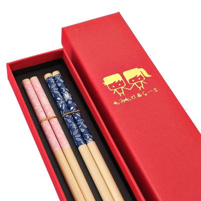 China Sustainable Red gift box sushi non-slip chopsticks couple chopsticks cute printed couple chopsticks for sale