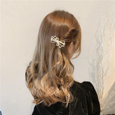 China Environmentally Friendly Net Red Back Head Imitation Pearl Hits Headdress Bow Girl Side Clip Top Side Hairpin for sale