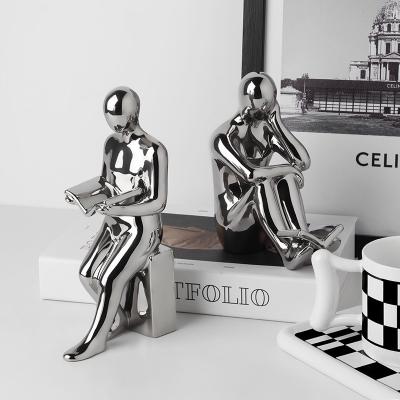 China Transient Modern Polish Ceramic Standing Human Folder Figure Silver Simplicity Desktop Ornaments Blue Book for sale