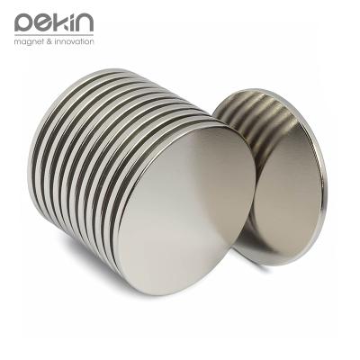 China Adhesive Industrial Strong Neodymium Rare Earth Pekin Magnet Disc Shaped Magnet With Round Thin Backing Strip Ideal For Kitchen Office Home Package for sale